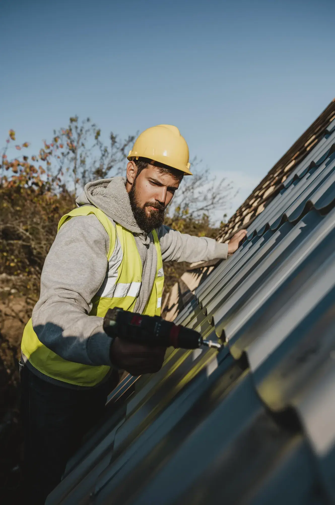 man-working-roof-with-drill